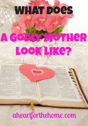 Open Bible with a construction paper pink heart with MOM printed in the middle.